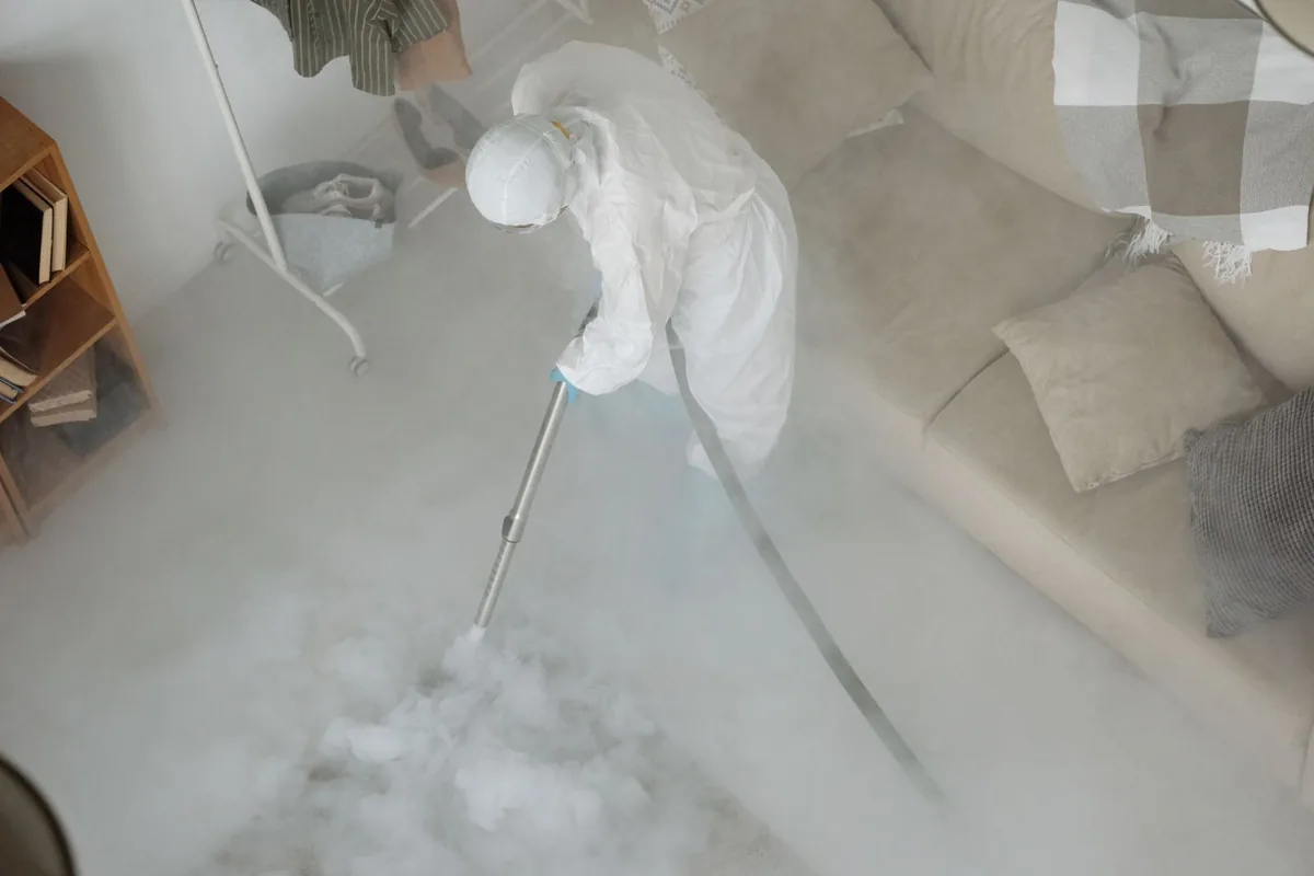 Biohazard cleanup technician in protective equipment, Schoolcraft, MI